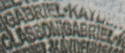 Magnified microtext repeatedly reads, 'GABRIEL KAYDEN CLASSON.'